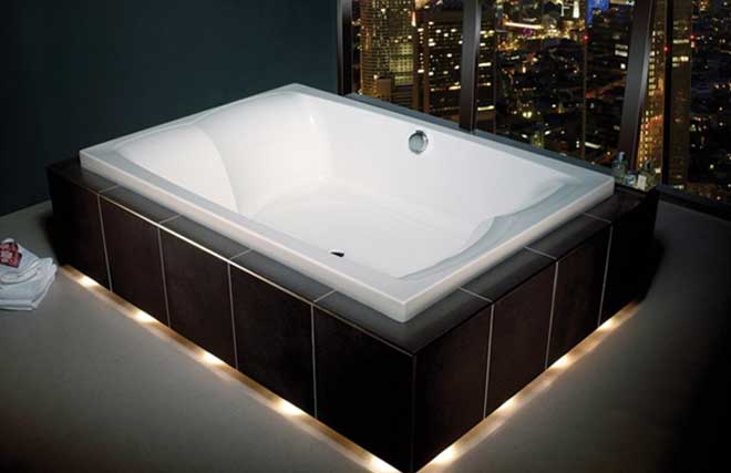 An inset Carron Celsius deep whirlpool bath
